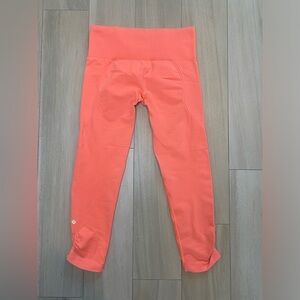 Lululemon crop orange mid rise leggings in the flow crop
